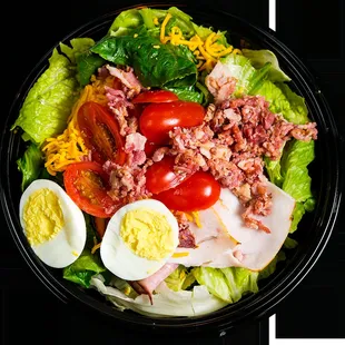 MEMBERS ONLY Ham, turkey, bacon, shredded sharp cheddar, hard-boiled egg, and tomato.