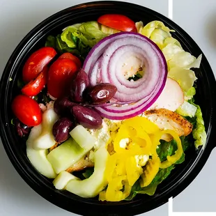 HIDE AND GO GREEK Chicken, feta cheese, grape tomatoes, cucumbers, kalamata olives, banana peppers, and red onions. Topped with croutons.
