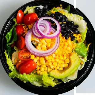 THE GD SPECIAL Chicken, sharp cheddar, grape tomatoes, corn, black beans, red onions, and diced avocado topped with tortilla strips.