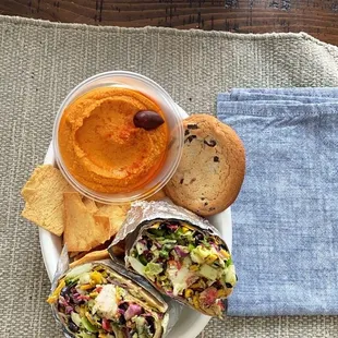 Make your own wrap, side of hummus and pita chips, cookie.