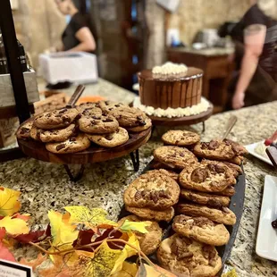a counter of cookies and pastries