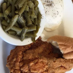a plate of fried chicken and green beans