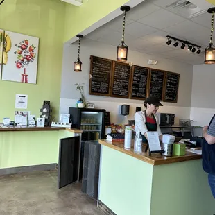 two people standing at the counter