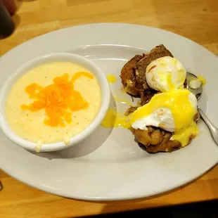 Short rib Eggs Benedict on hash brown and grits