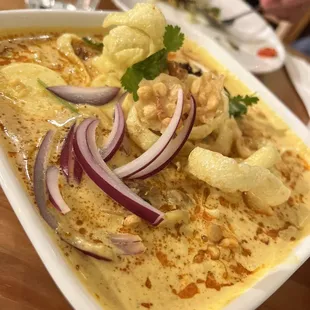 a dish of curry with onions and cauliflower