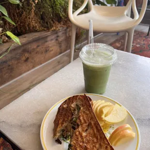 Mushroom arugula and goat cheese panini came with apple slices and a matcha oatmilk latte. Both delish