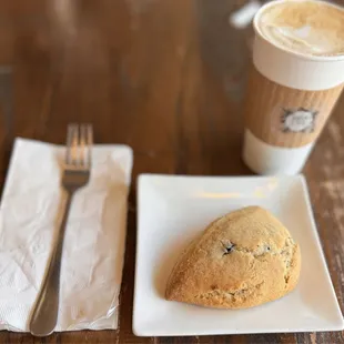 Medium cappuccino and blueberry scone