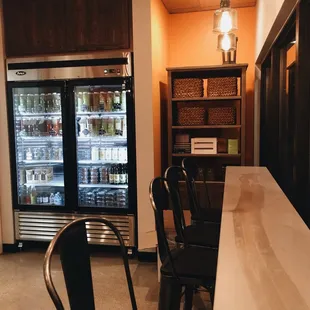 a bar with black chairs