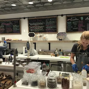 a woman working behind the counter
