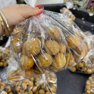 a person holding a bag of potatoes