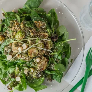 a plate of spinach salad