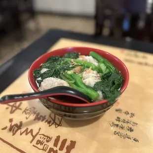 a bowl of soup with a spoon