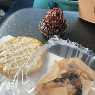 vegan lemon cookie, vegan blueberry muffin and vegan chocolate cupcake