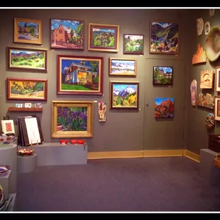 Some of the captivating paintings of local scenes at Green Horse Gallery.