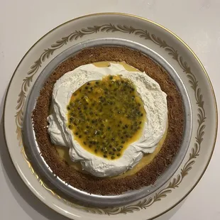 Passion fruit crème pie with real passion fruit pulp for topping! And coconut graham crust