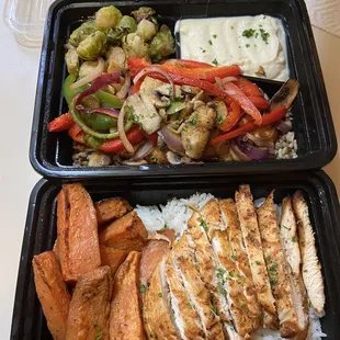 two trays of chicken and vegetables