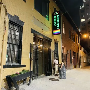 a woman standing outside of a building