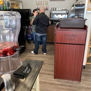 two people standing in the kitchen