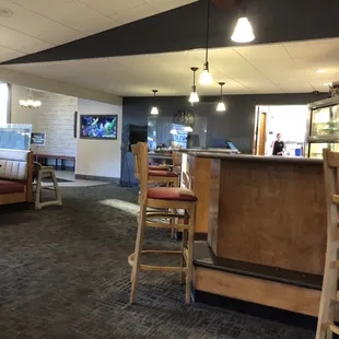 Dining area looking towards counter and entrance
