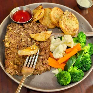 Lentil loaf with steamed veggies and roasted potatoes