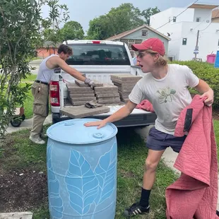 Finn &amp; Will installation of rain barrel.