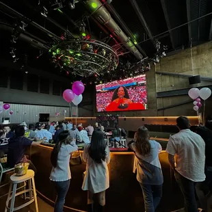 a crowd of people at a bar