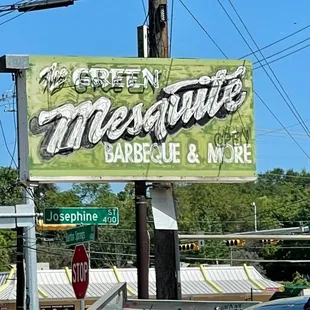a sign for a green mesquite barbecue and more