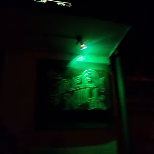a neon sign in the dark