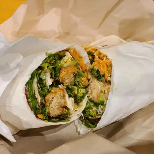 Peanut chicken burrito. Mock chicken, fresh greens cabbage, carrots, green onions and crushed peanuts, sweet house peanut vinaigrette