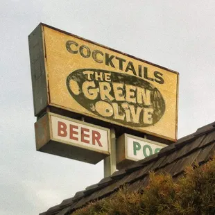 sign for cocktails and green olive
