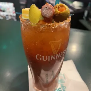 a bloody drink with a blue straw