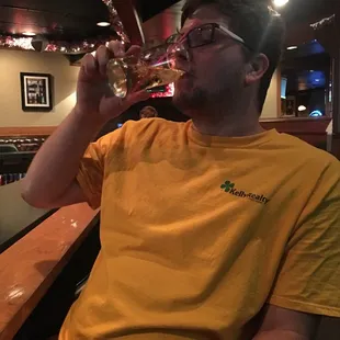 a man drinking a glass of wine