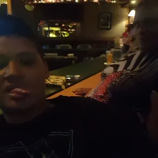 a group of people sitting at a bar