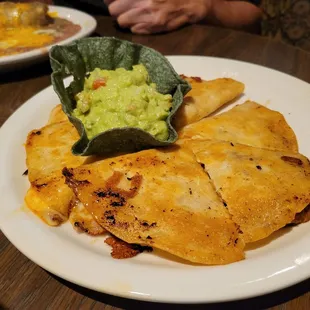 Shredded beef quesadilla with guacamole.