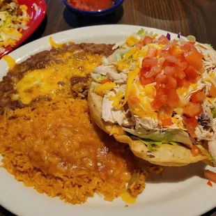 Combination plate with chicken tostada and taco (on other plate).