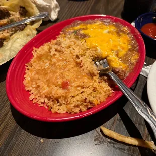 a plate of mexican food with rice and beans