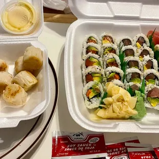 To Go Order (left)  Shu-mai with house special sauce (right) two sushi rolls and one Rainbow specialty roll.