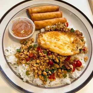 To Go Order, Happy Meal, Basil Country Style, Chopped chicken stir fried with veggies top with egg. With an order of Siam rolls (egg roll)