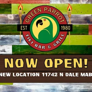 a sign with the words now open