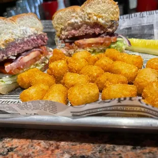 a sandwich and tater tots