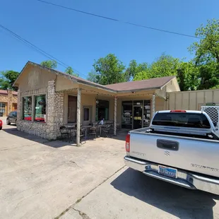 a pickup truck parked in front of a restaurant