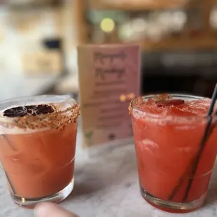 two cocktails on a table