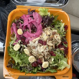 a salad in a plastic container
