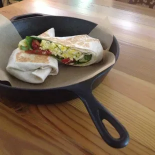 Vegetarian burrito with local scramblers eggs, Great Lakes cheddar, advocacy, spinach, and chimichurri. Mmmmmmmmm
