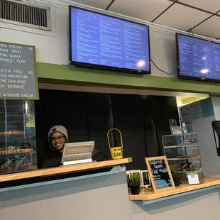 a woman behind the counter