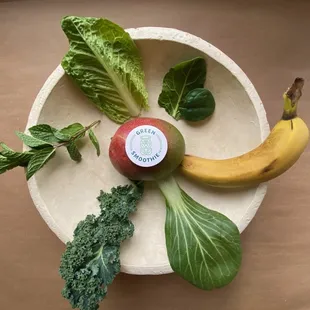 a banana, lettuce, and an apple