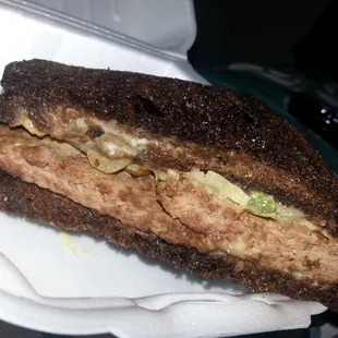 a sandwich in a styrofoam container