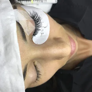 a woman with eyelashes on her eyes