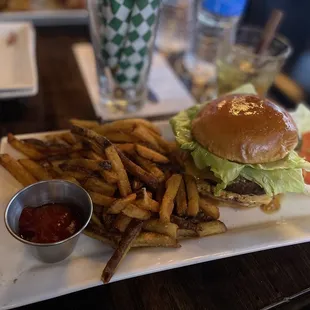 a burger and fries on a plate