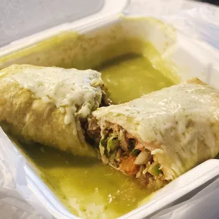 Fried fish burrito (wet) with green sauce. Slightly spicy &amp; very flavorful!